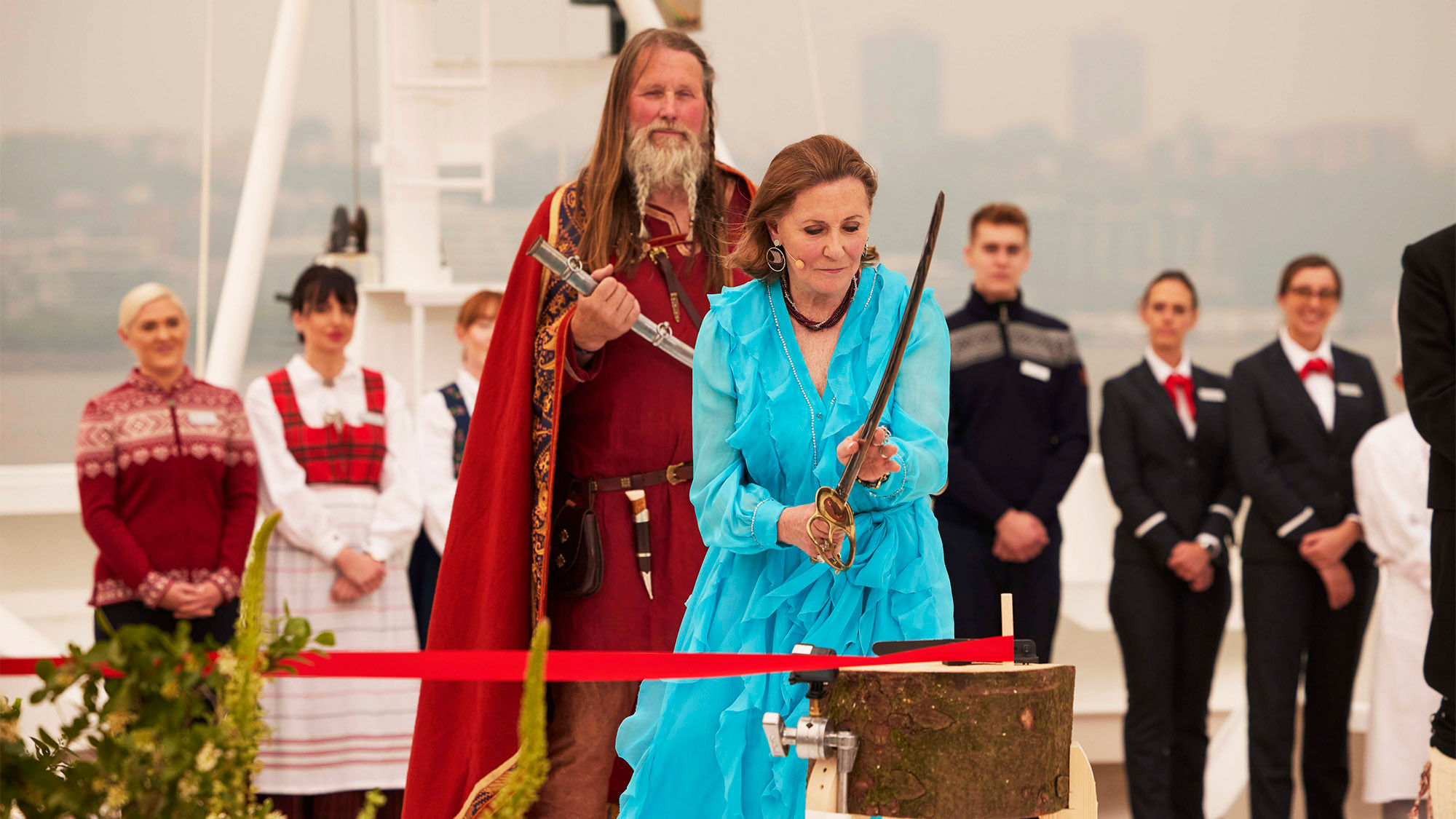 The Viking Saturn's godmother, philanthropist and Metropolitan opera chairwoman Ann Ziff, used a sword from a Met production of "Il Trovatore" to cut a ribbon that released a bottle of Norwegian aquavit into the hull.