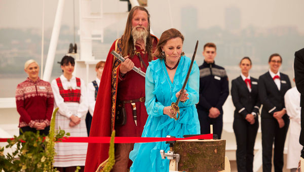 The Viking Saturn's godmother, philanthropist and Metropolitan opera chairwoman Ann Ziff, used a sword from a Met production of "Il Trovatore" to cut a ribbon that released a bottle of Norwegian aquavit into the hull.