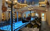 The center of the Canal Grande Restaurant on the Carnival Venezia features a gondola on a faux canal.