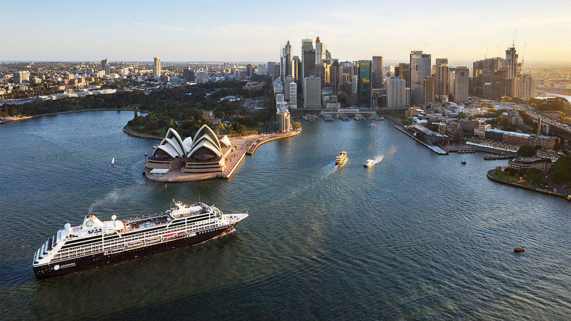 The Azamara Journey motors into Sydney Harbor. Perry Golf partners with Azamara on golf itineraries in the South Pacific.