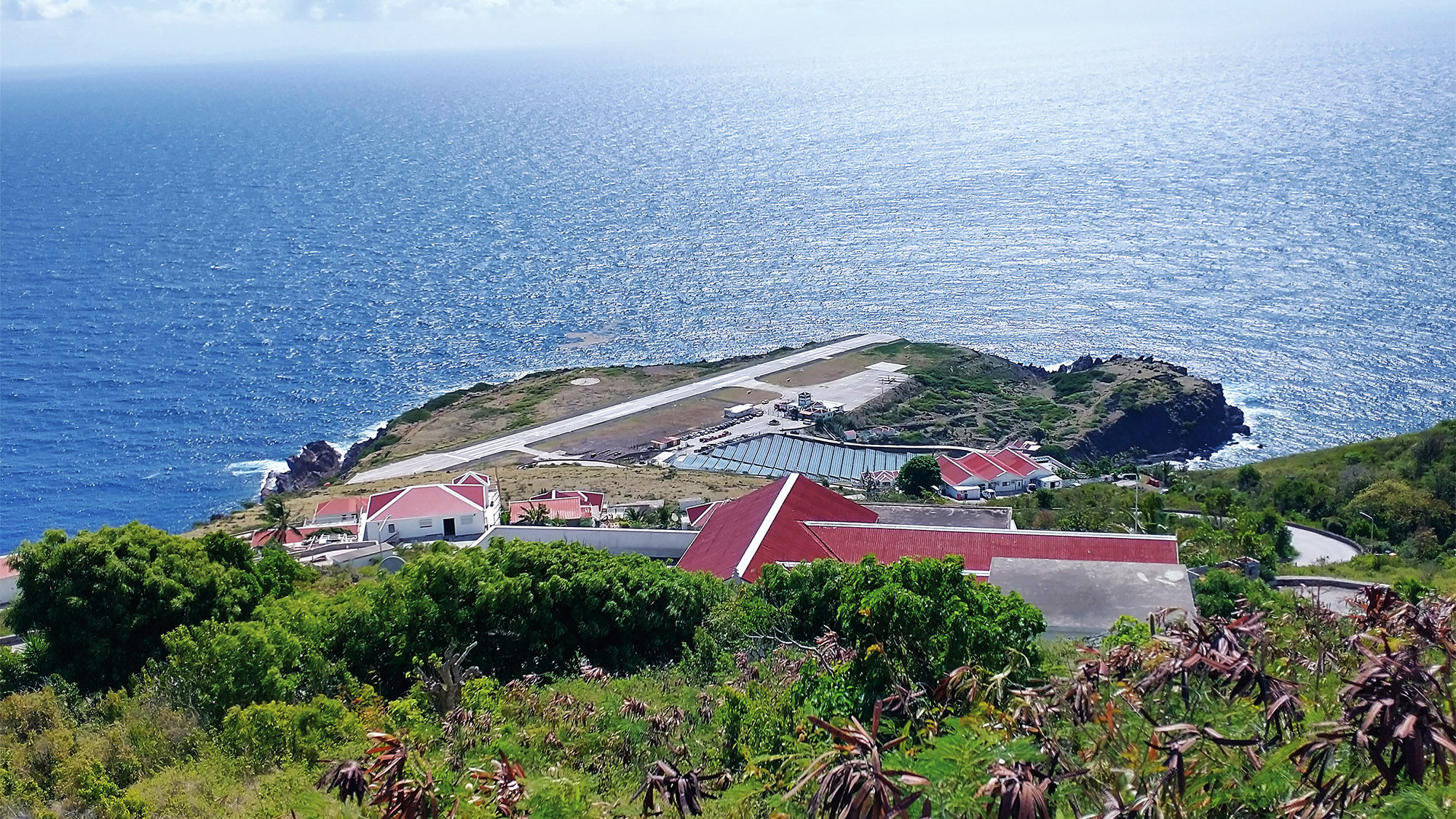 The island's Juancho E. Yrausquin Airport has a short runway that ends in a cliff on each side.