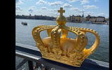 The golden crown, one of the symbols of Sweden, is captured on a bridge across from Stockholm's historic Old Town or Gamlastan.
