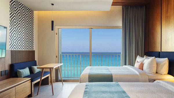 A double bed balcony beachfront guestroom at the Hilton Cancun Mar Caribe. A double bed balcony beachfront guestroom at the Hilton Cancun Mar Caribe.