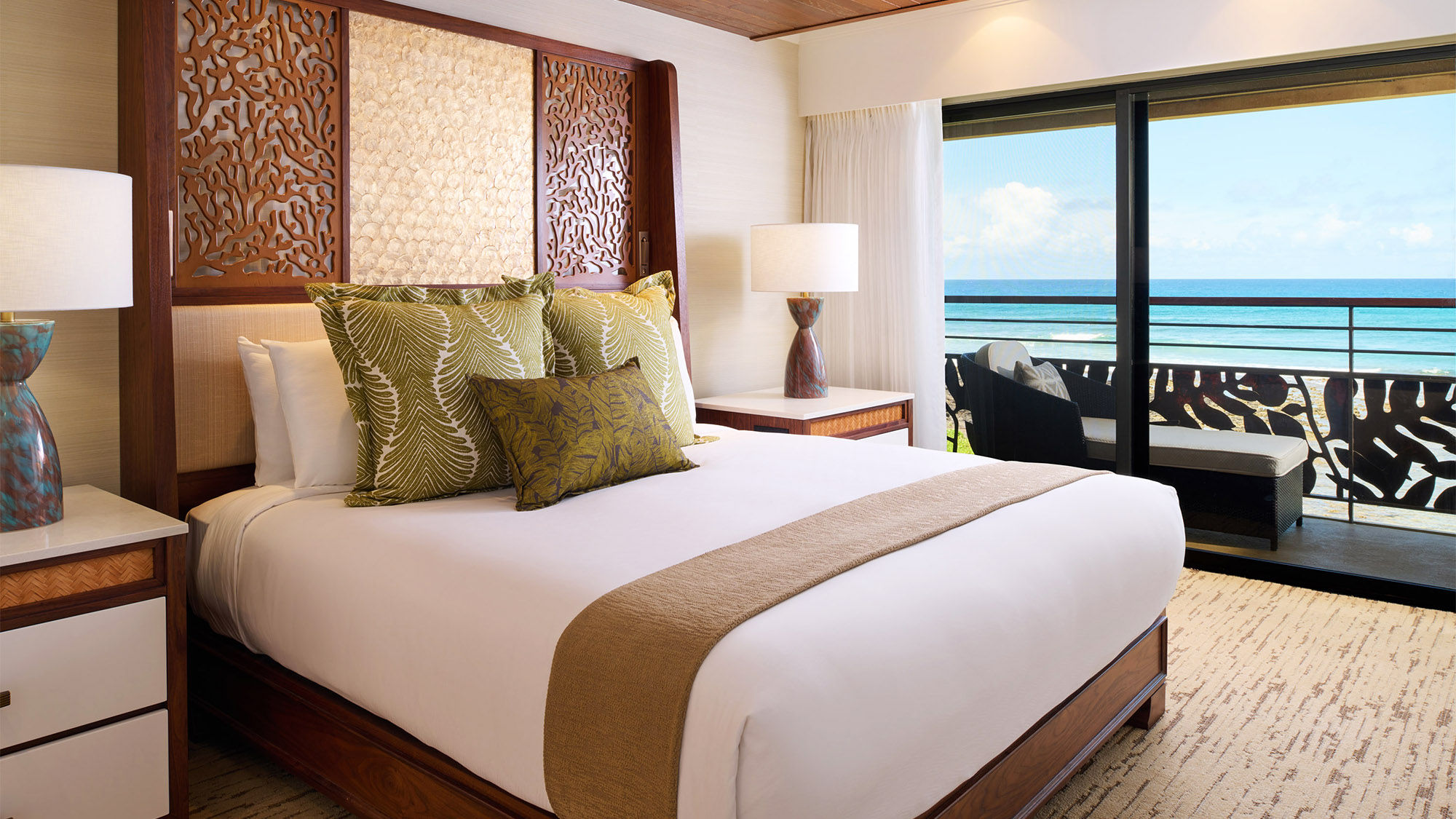 Ko'a Kea's newly renovated Oceanfront Suites are roomy and feature a private balcony and a living room.