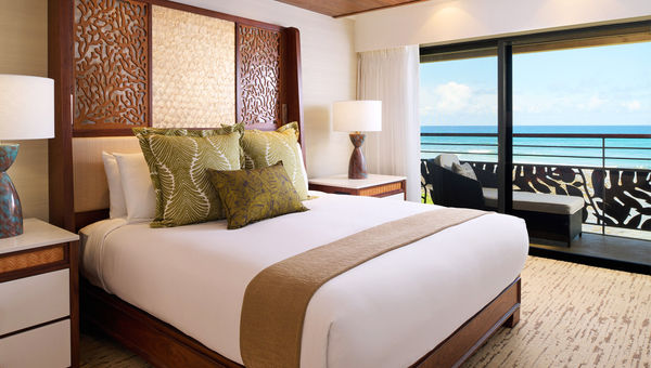 Ko'a Kea's newly renovated Oceanfront Suites are roomy and feature a private balcony and a living room.