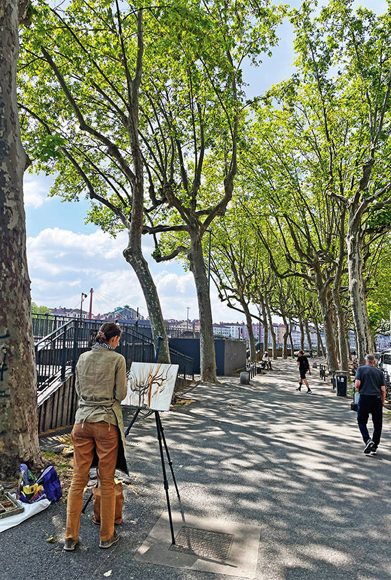 An artist creates on the banks of the Rhone.