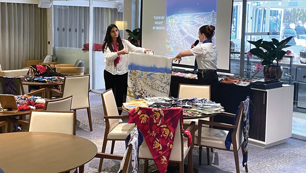 A silk demonstration on a Viking river cruise; Lyon has a rich history with the fabric.