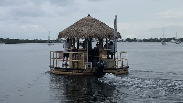 A Cruisin' Tikis craft motoring away from Snook's Bayside in Key Largo. A Cruisin' Tikis craft motoring away from Snook's Bayside in Key Largo.