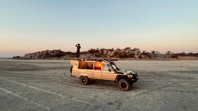 Mhondoro Landcruisers can transform into game-viewing vehicles with elevated platforms.