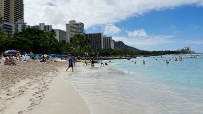 Morning on Waikiki Beach in mid-August. The tourism district, as well as the island as a whole, saw an occupancy bump the week after the Maui fires.