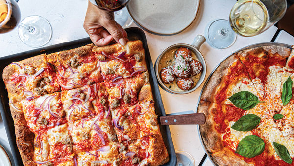 Adrienne's Pizzabar, a recent transplant from New York, serves signature pizzas and citrusy aperitivo spritzes. Adrienne's Pizzabar, a recent transplant from New York, serves signature pizzas and citrusy aperitivo spritzes.