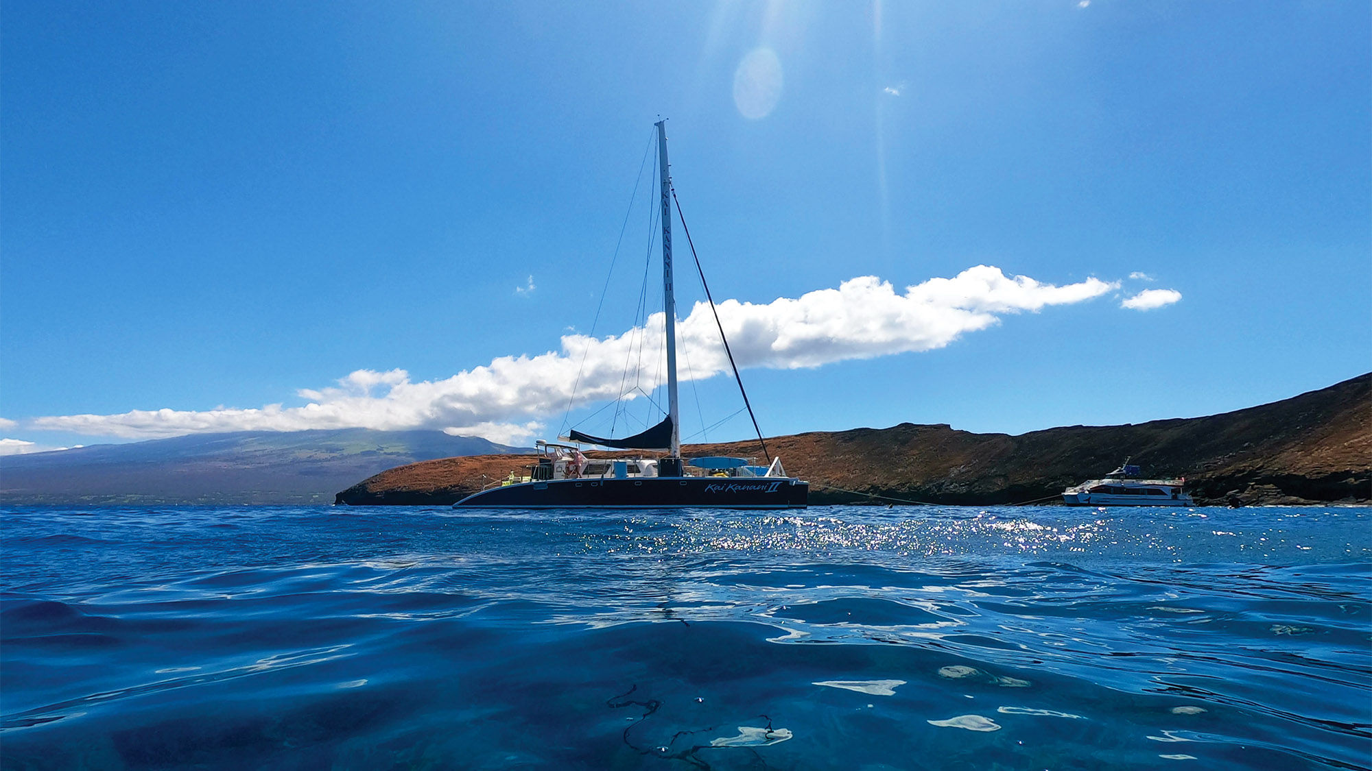 The Kai Kanani II catamaran moored off Molokini during the snorkeling tour.