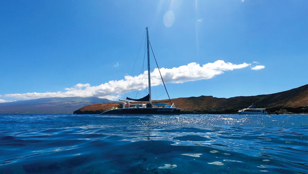 The Kai Kanani II catamaran moored off Molokini during the snorkeling tour.