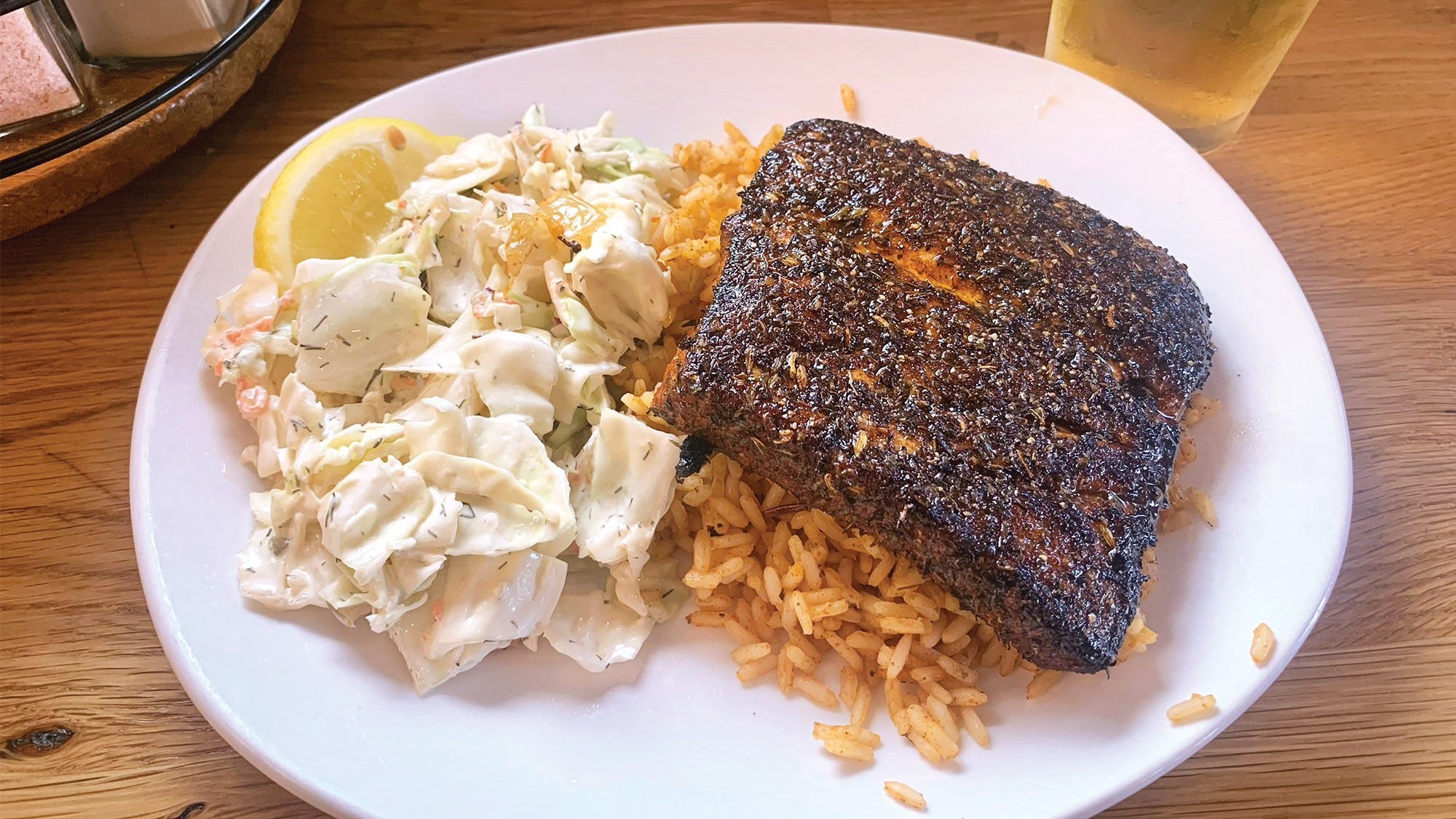 The fresh-catch plate at the Paia Fish Market, featuring blackened mahi mahi, Cajun rice and housemade coleslaw.