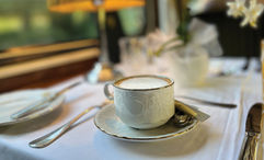 Afternoon tea in the dining car of the Golden Eagle Danube Express.