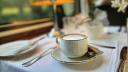 Afternoon tea in the dining car of the Golden Eagle Danube Express.