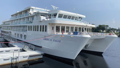 The coastal catamaran-style American Eagle sits docked on the Penobscot River in Bangor, Maine.