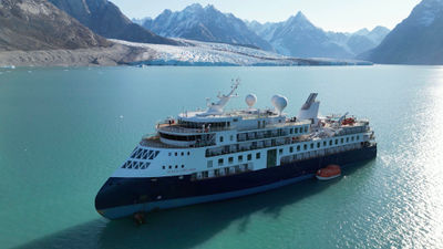 The Ocean Explorer ran aground in the Alpefjord in Northwest Greenland National Park on Sept. 11. It was pulled free by a fishing research ship Thursday.