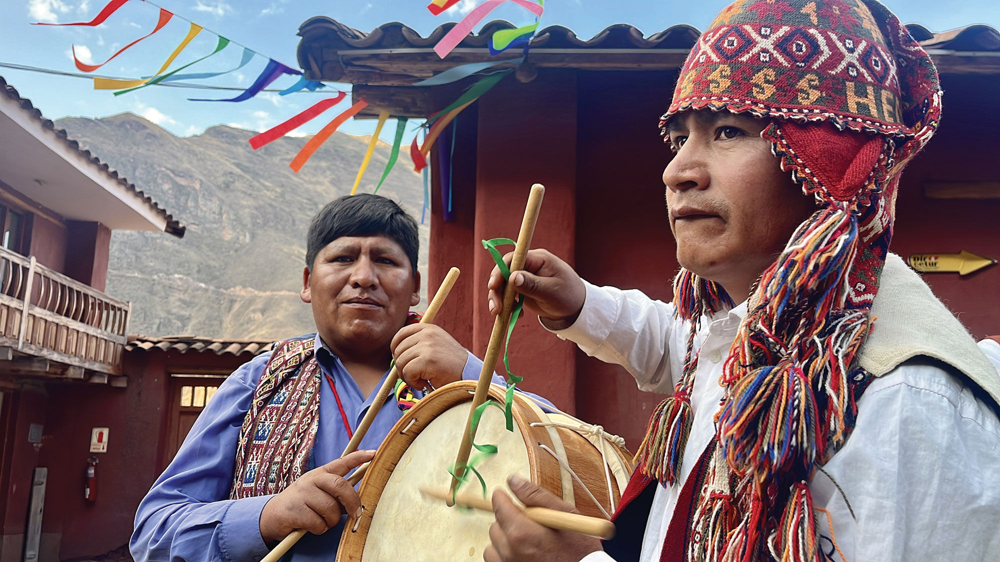 Peruvian men play music on traditional Andean instruments at the G Adventures-supported Parwa Community Restaurant.