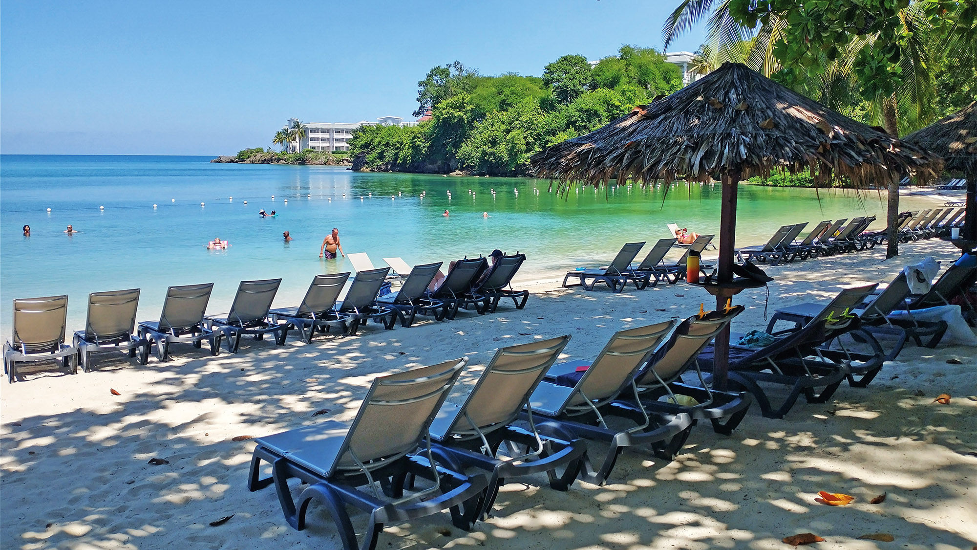 The resort's Sunset Cove beach offers guests a secluded, verdant experience.