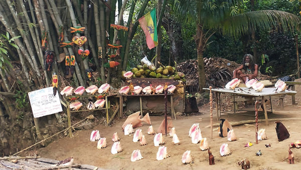A vendor sells his wares along the river. A vendor sells his wares along the river.