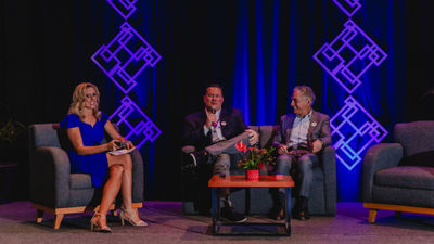 ALG Vacations executive vice president Jacki Marks moderates a fireside chat with ALG Vacations group president Ray Snisky (center) and Hyatt CEO Mark Hoplamazian.