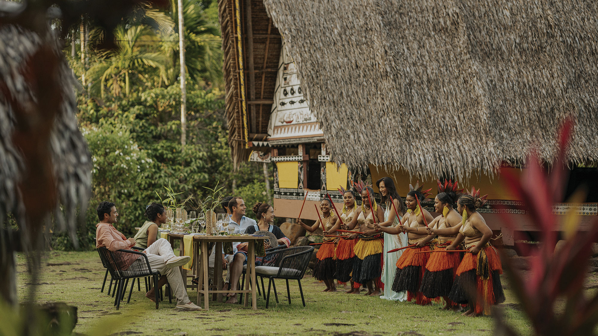 Guests enjoying an on-shore cultural experience as part of their stay aboard the Four Seasons Explorer, Palau.