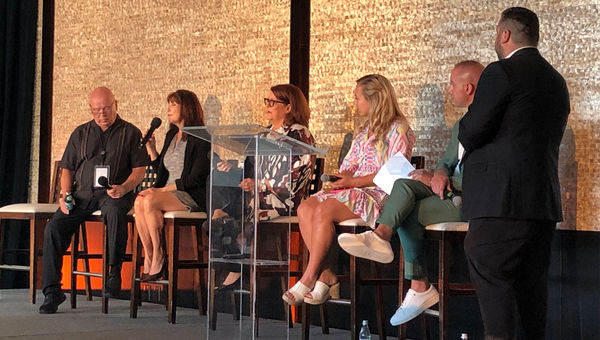 A panel at the Affluent Travel Collection Symposium.