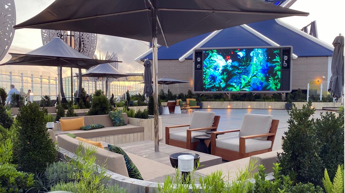 A variety of plants line a sitting area in the Rooftop Garden on Celebrity Ascent.
