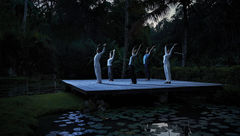 Guests participate in a Full Moon Yoga session at the Four Seasons Bali at Sayan.