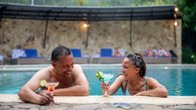 Relaxing in the pool at the Rio Celeste Hideaway Hotel on a Geluxe tour in Costa Rica.