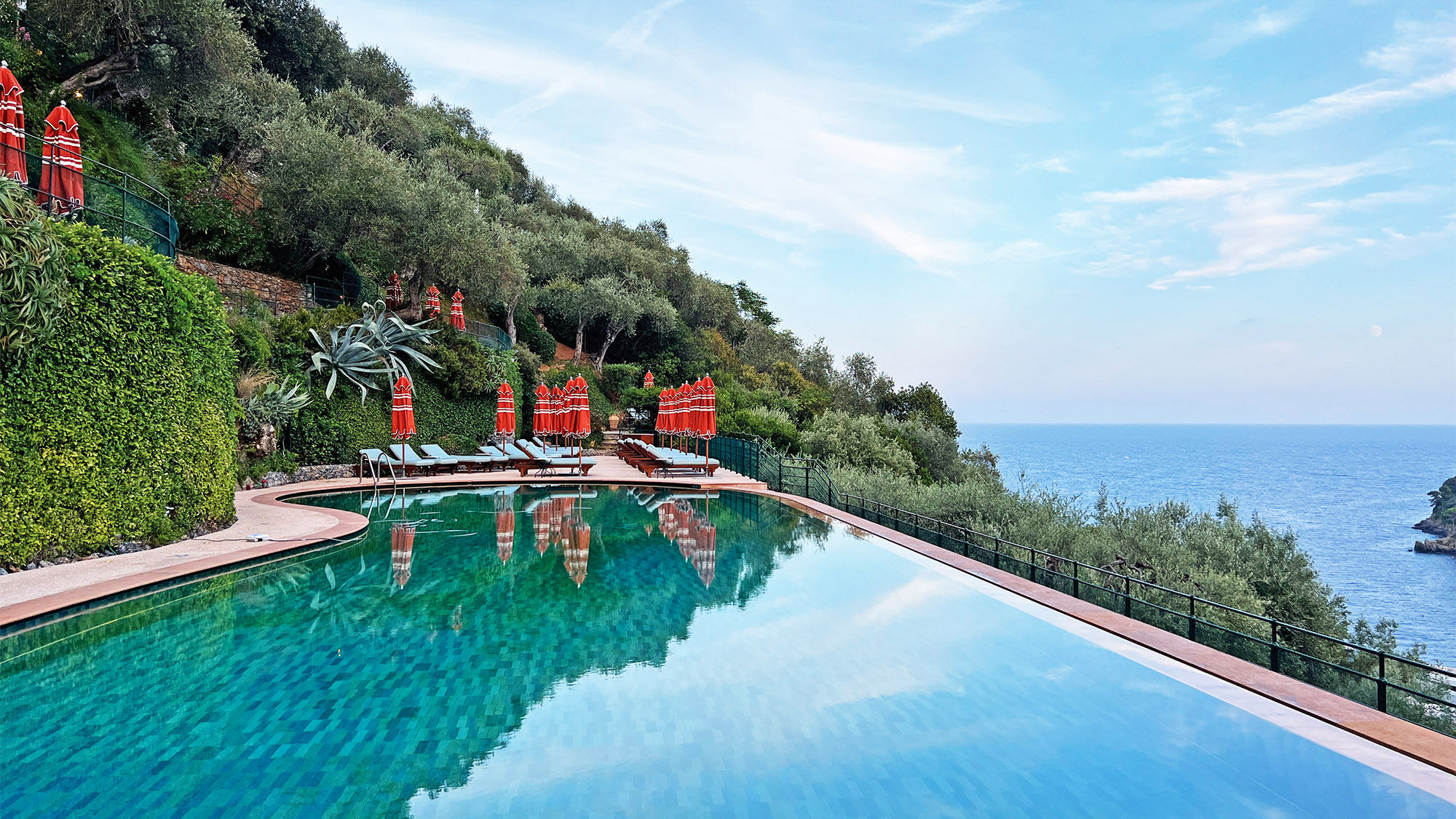 The refurbished infinity-edge pool contains tile work that is meant to mirror the color of the Ligurian Sea.