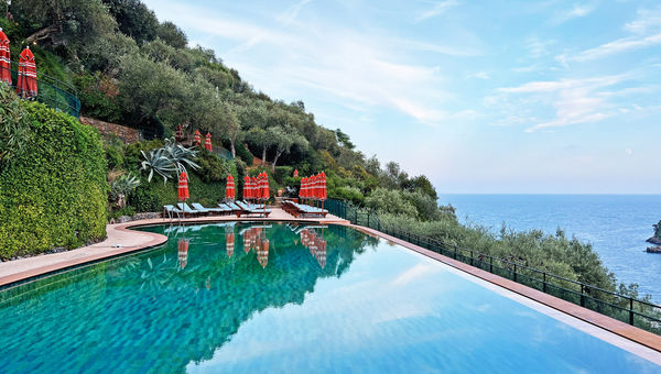 The refurbished infinity-edge pool contains tile work that is meant to mirror the color of the Ligurian Sea. The refurbished infinity-edge pool contains tile work that is meant to mirror the color of the Ligurian Sea.