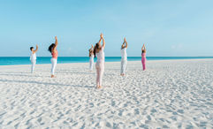 Yoga sessions alonside the crystal-clear Caribbean is one of the activities available as part of Bucuti & Tara Beach Resort's Regenerative Tranquility Package.