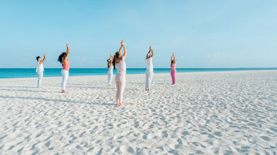 Yoga sessions alonside the crystal-clear Caribbean is one of the activities available as part of Bucuti & Tara Beach Resort's Regenerative Tranquility Package.