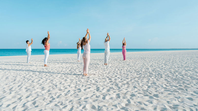 Yoga sessions alonside the crystal-clear Caribbean is one of the activities available as part of Bucuti & Tara Beach Resort's Regenerative Tranquility Package.
