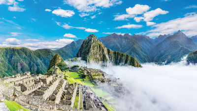 Agricultural terraces and ancient houses in Machu Picchu. The daily visitor cap for Machu Picchu is expected to rise from 4,044 to 4,500 this year.