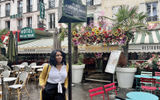 The author rests underneath a Paris sign honoring Josephine Baker, an African American entertainer and expat who made France her home and became a national icon of the country. Part of a stop on the three-night extension to Paris for the Soulful Experience river cruise itinerary.