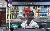 Street art portrait of an Afro Caribbean woman painted on a garage door in Little Africa, a cultural hub and neighborhood in Paris, where the Soulful Experience itinerary takes guests on an afternoon excursion.