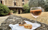 A glass of chilled rose served with shaved black truffles over baguette slices at Ayme Truffe in Grignon, where guests on the inaugural Soulful Epicurean Expeirence itinerary went on a truffle hunting excursion.