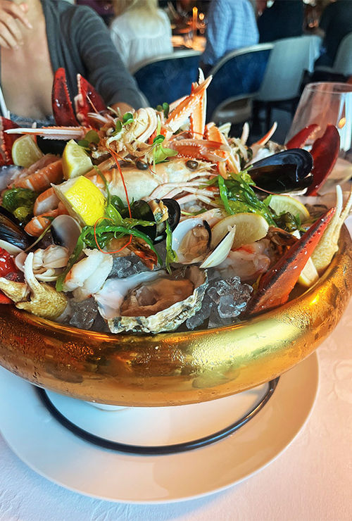 An ample seafood tower featuring oysters, shrimp, mussels, clams, langoustine and lobster at The Catch by Rudi.