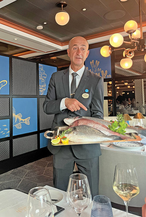 The catch of the day, branzino, presented tableside by the maitre d' at The Catch by Rudi.
