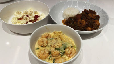 The fruits -- and shrimp -- of the author's labor. Clockwise from the bottom, New New Orleans pasta, strawberries Romanoff and gumbo.