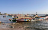 Pirogue motorboats, a staple of marine transportation in West Africa. The boats seen here rest on the shores of Djiffer, Senegal, a town that Variety Cruises calls on during its West Africa sailings between Senegal and the Gambia.