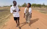 The author walks in the village of Kuntaur with resident Lamin Cham, who is also assistant project manager at the Lamin Koto School, which was built by Variety Cruises in 2012. Kuntaur is one of the ports Variety calls on during sailings on the Gambia River.