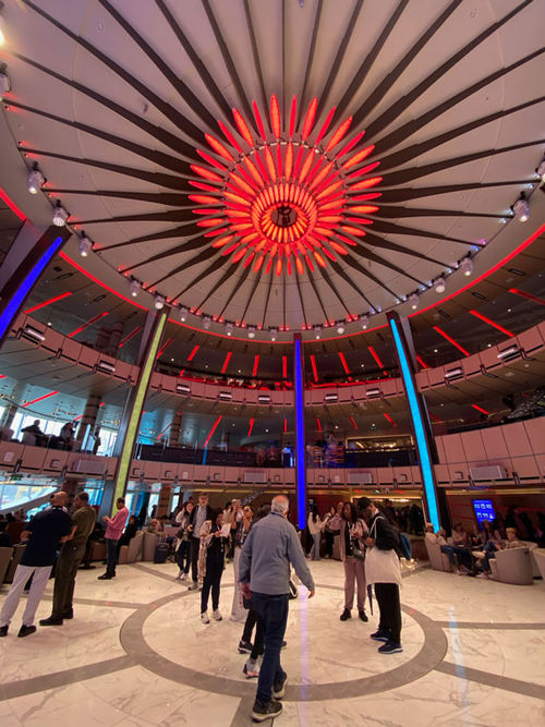 The circular atrium of the Sun Princess is surrounded with seating for events and people-watching.