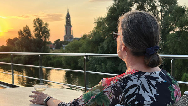 A woman vacationing solo on a Tauck river cruise. A woman vacationing solo on a Tauck river cruise.