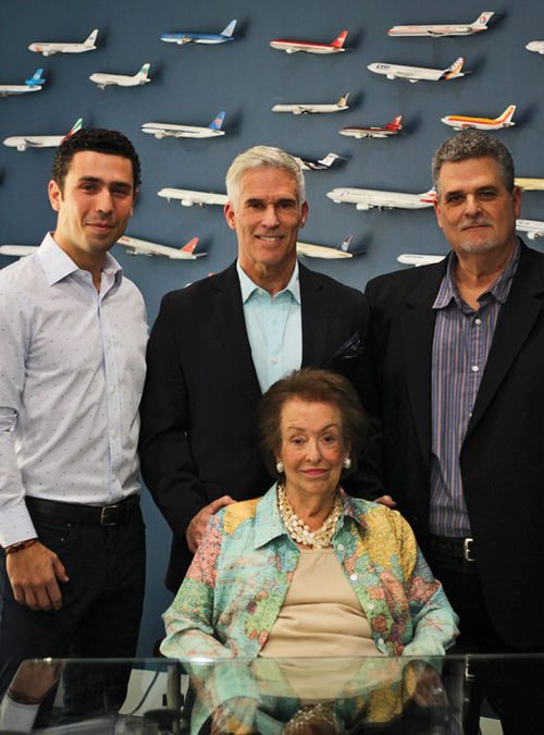 Luisa Guiteras with her son Greg Guiteras (center), CEO of Lorraine Travel; Greg's nephew Richie Massa (left), the agency’s director of sales and business development; and her son Louis Guiteras, a corporate travel advisor with the agency, in a December 2022 photo.