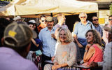 Christy Walton, seated on the chair to the left, at the opening of the Museo de Vaquero de las Californias.