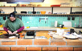 A cook in Las Alforjas (the Saddlebags) Cafe in the Museo de Vaquero de las Californias prepares fresh tortillas.